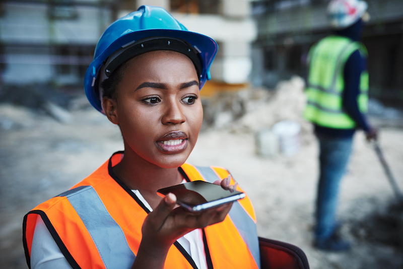 factory worker with smartphone