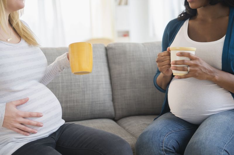 Pregnant women drinking coffee